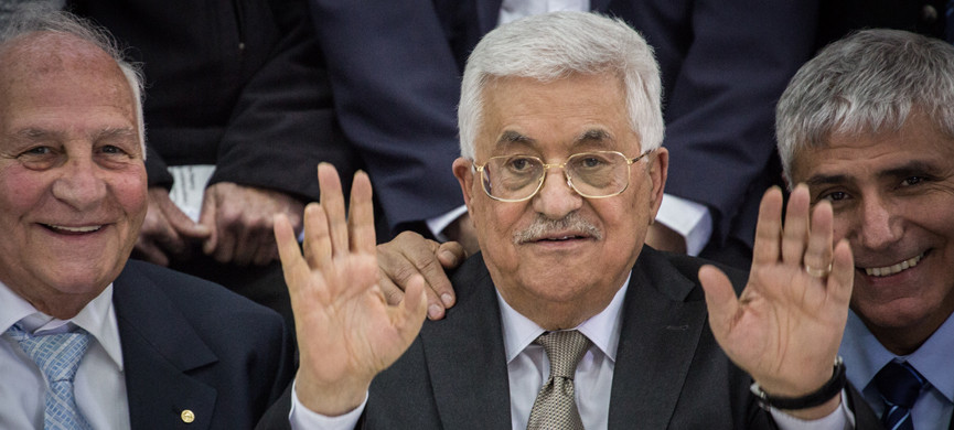 Palestinian Authority President Mahmoud Abbas poses for a picture with a delegation of the Federation of Jews from Arab countries, during a meeting at the Muqaata in Ramallah, West Bank, on March 28, 2016. The delegation met with Abbas in order to promote dialogue, good relations, and peace between Israel and the Palestinians. Photo by Hadas Parush/Flash90