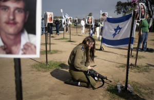 <p>An Israeli soldier weeps at the marker for a loved one kidnapped on Oct. 7 in a cross-border attack by Hamas at the Nova music festival, after a press conference at the site in Re'im, southern Israel, Friday, Jan. 5, 2024. (AP Photo/Maya Alleruzzo)</p>