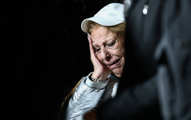 <p>A woman mourns during the funeral of brother Yaakov and sisters Sara and Avigail Biton who were killed in an Iranian missile strike on Sunday, amid the U.S.-Israel conflict with Iran, in a cemetery in Jerusalem March 2, 2026. REUTERS/Jamal Awad</p>