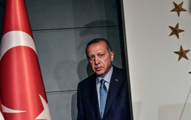 <p>TOPSHOT - Turkish President Recep Tayyip Erdogan arrives to deliver a speech on June 24, 2018 in Istanbul, after initial results of Turkey's presidential and parliamentary elections. Erdogan on June 24 declared victory in a tightly-contested presidential election, extending his 15-year grip on power in the face of a revitalised opposition. Turkish voters had for the first time cast ballots for both president and parliament in the snap polls, with Erdogan looking for a first round knockout and an overall majority for his ruling Justice and Development Party (AKP). / AFP PHOTO / BULENT KILICBULENT KILIC/AFP/Getty Images</p>