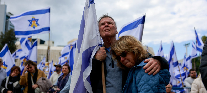 <p>People gather, on the day the bodies of deceased Israeli hostages, Oded Lifschitz, Shiri Bibas and her two children Kfir and Ariel Bibas, who were kidnapped during the deadly October 7, 2023 attack by Hamas, are handed over under the terms of a ceasefire between Hamas and Israel, in Tel Aviv, Israel February 20, 2025. REUTERS/Ammar Awad</p>